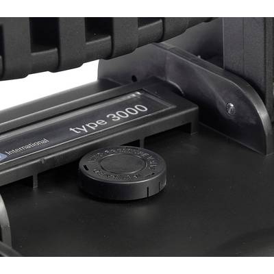 Un appareil noir portant l'inscription 'type 3000' sur une étiquette. Au premier plan, un bouton rond étiqueté.