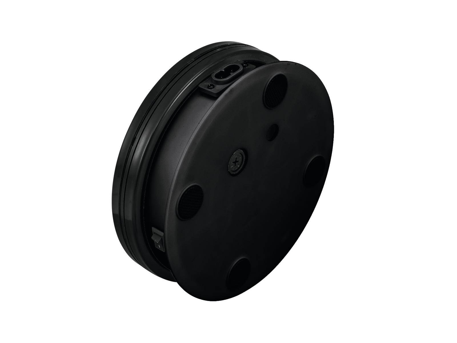 Un appareil noir, rond, doté de plusieurs ouvertures et connexions, probablement un composant technique ou électronique.