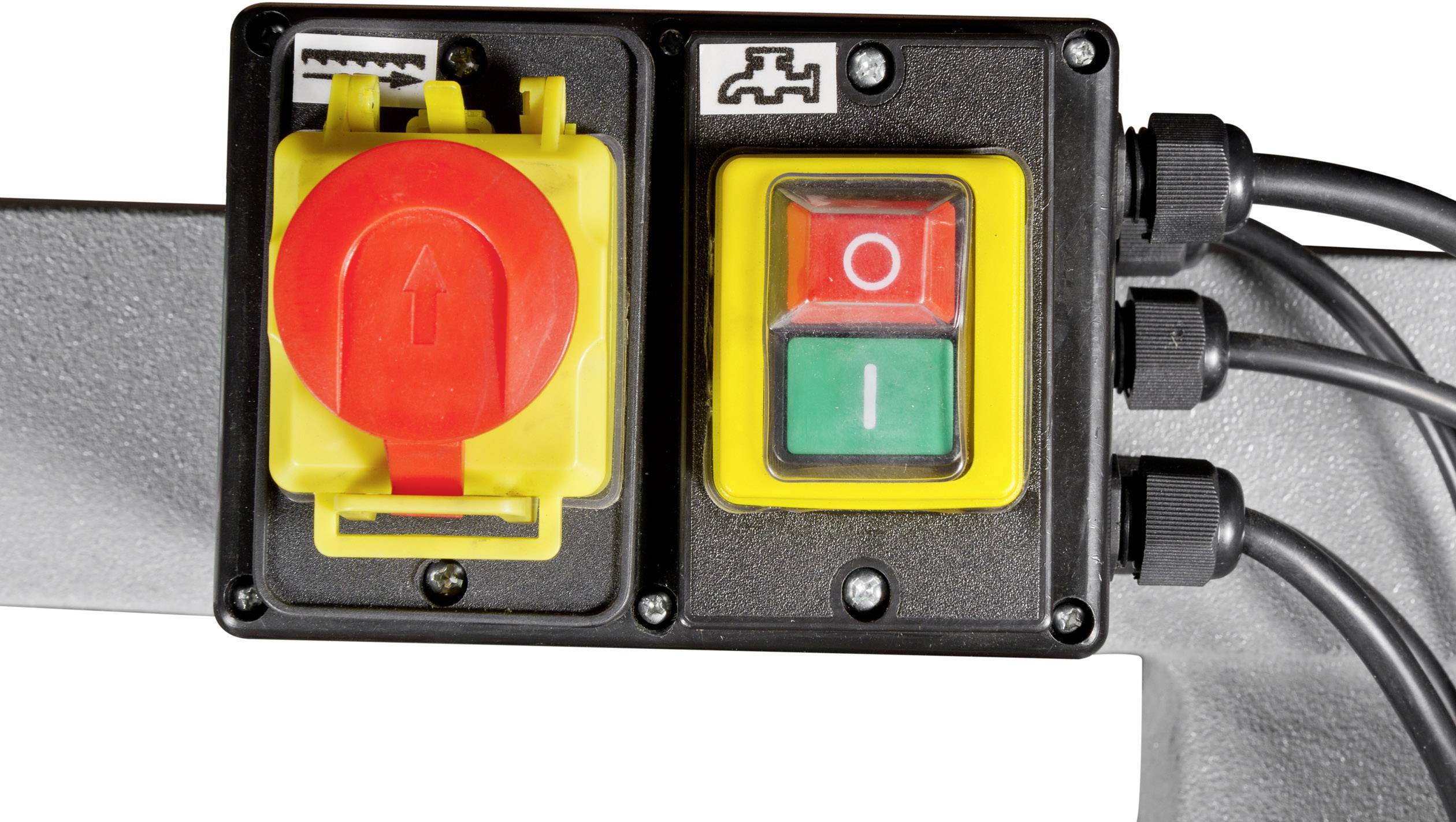 Bouton d'arrêt d'urgence rouge à côté d'un interrupteur marche-arrêt vert et rouge sur un dispositif qui contrôle les modes de fonctionnement électriques.