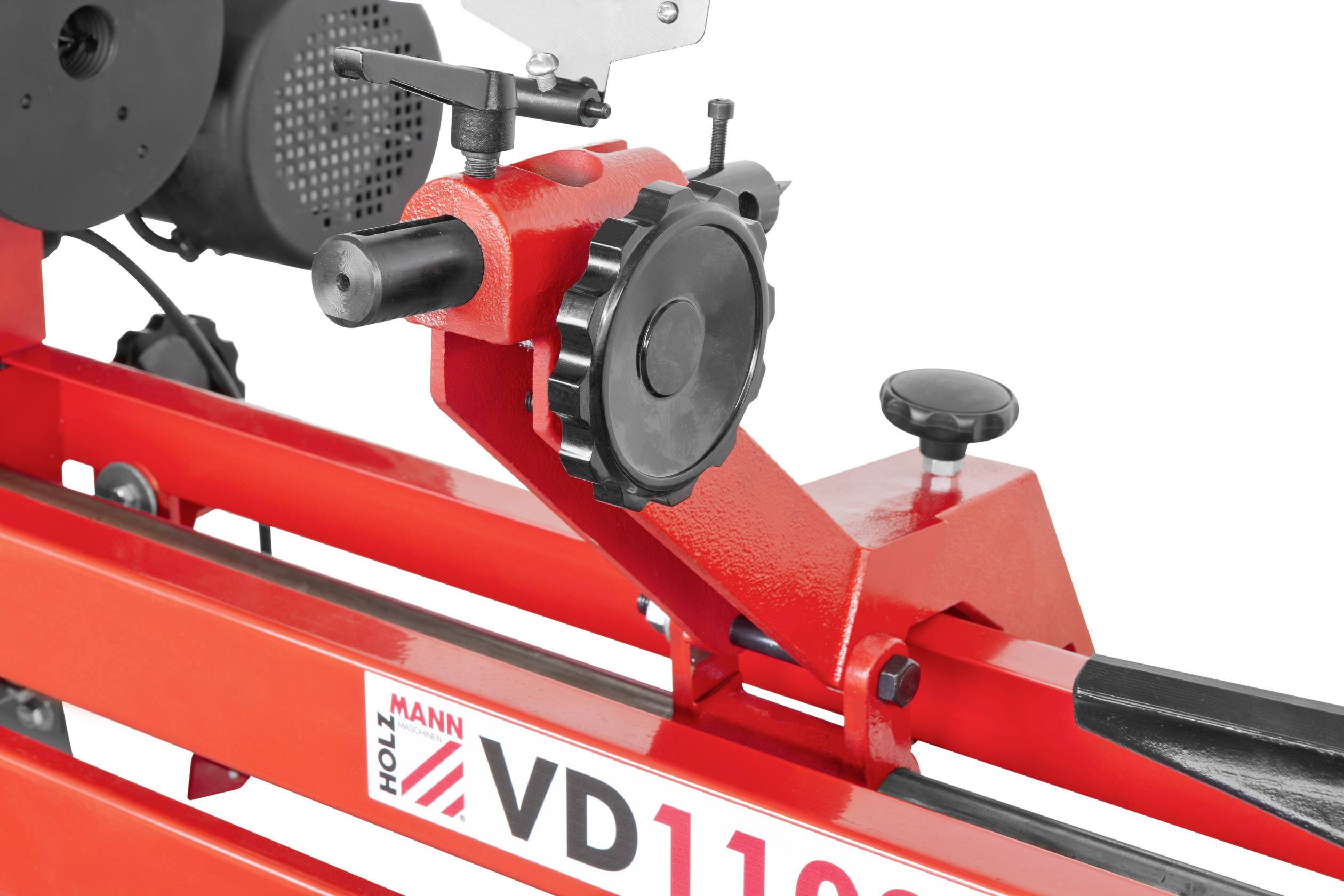 Un cadre métallique rouge avec de grands boutons rotatifs et un moteur électrique, marqué 'VD1100' et portant le logo 'Holzmann'.