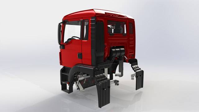 Cabine de camion rouge, vue de trois-quarts arrière, sur un fond gris. Intérieur partiellement visible.