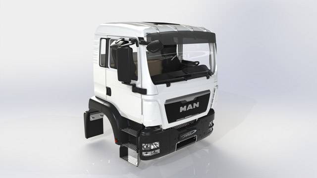Un camion blanc sans carrosserie, visible de face et légèrement de côté. Le logo 'MAN' est visible sur la calandre.