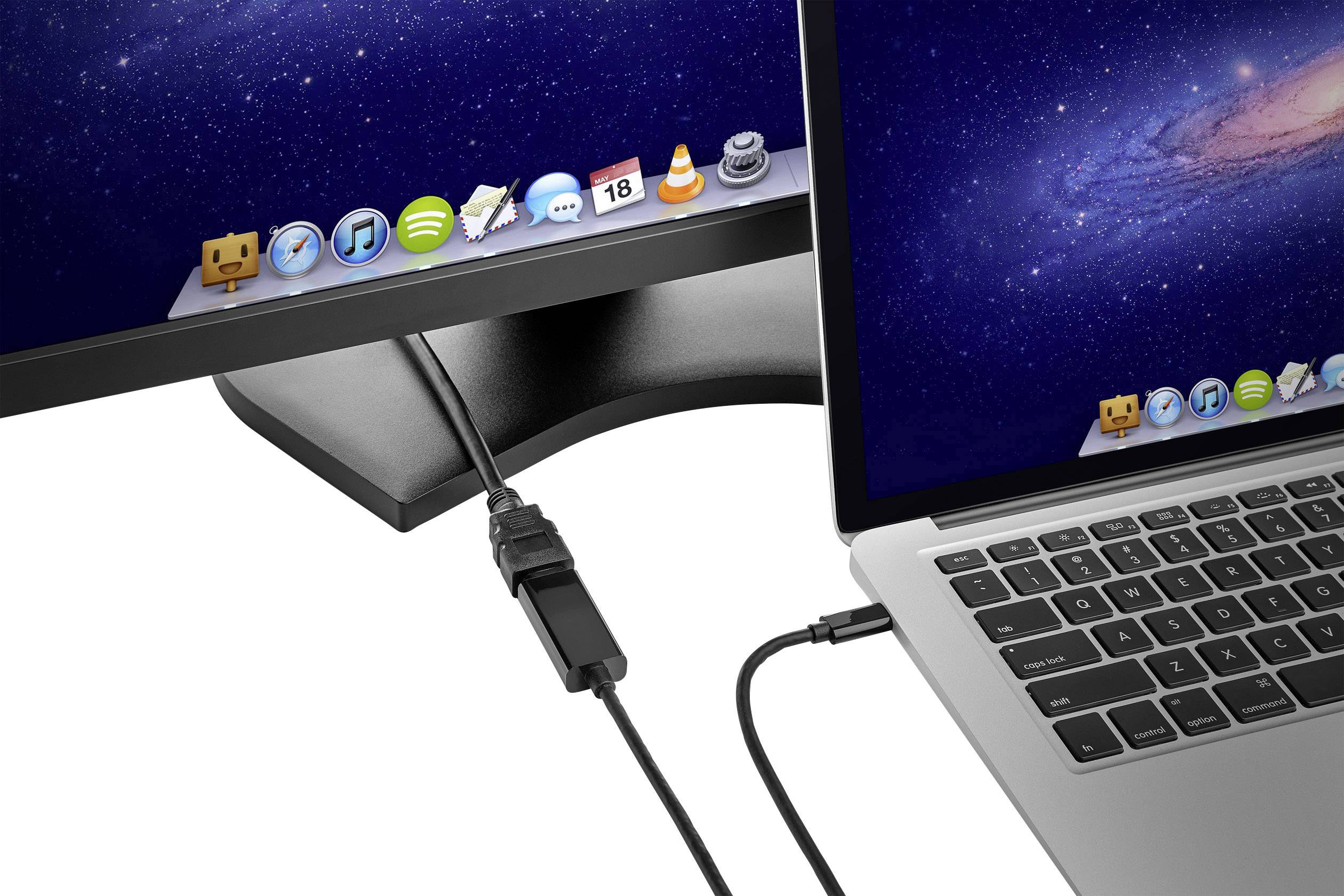 Un ordinateur portable avec macOS est connecté à un écran externe via un câble. Les deux écrans affichent le même fond d'écran.