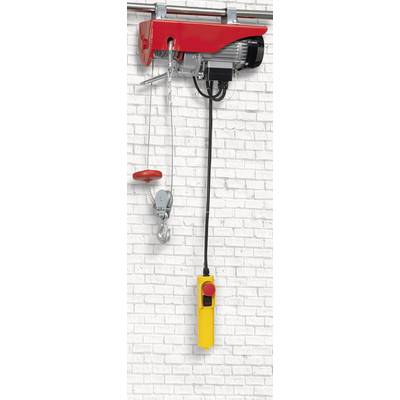 Un treuil électrique rouge avec une commande jaune, fixé à un mur de briques blanches. Adapté pour soulever des charges.