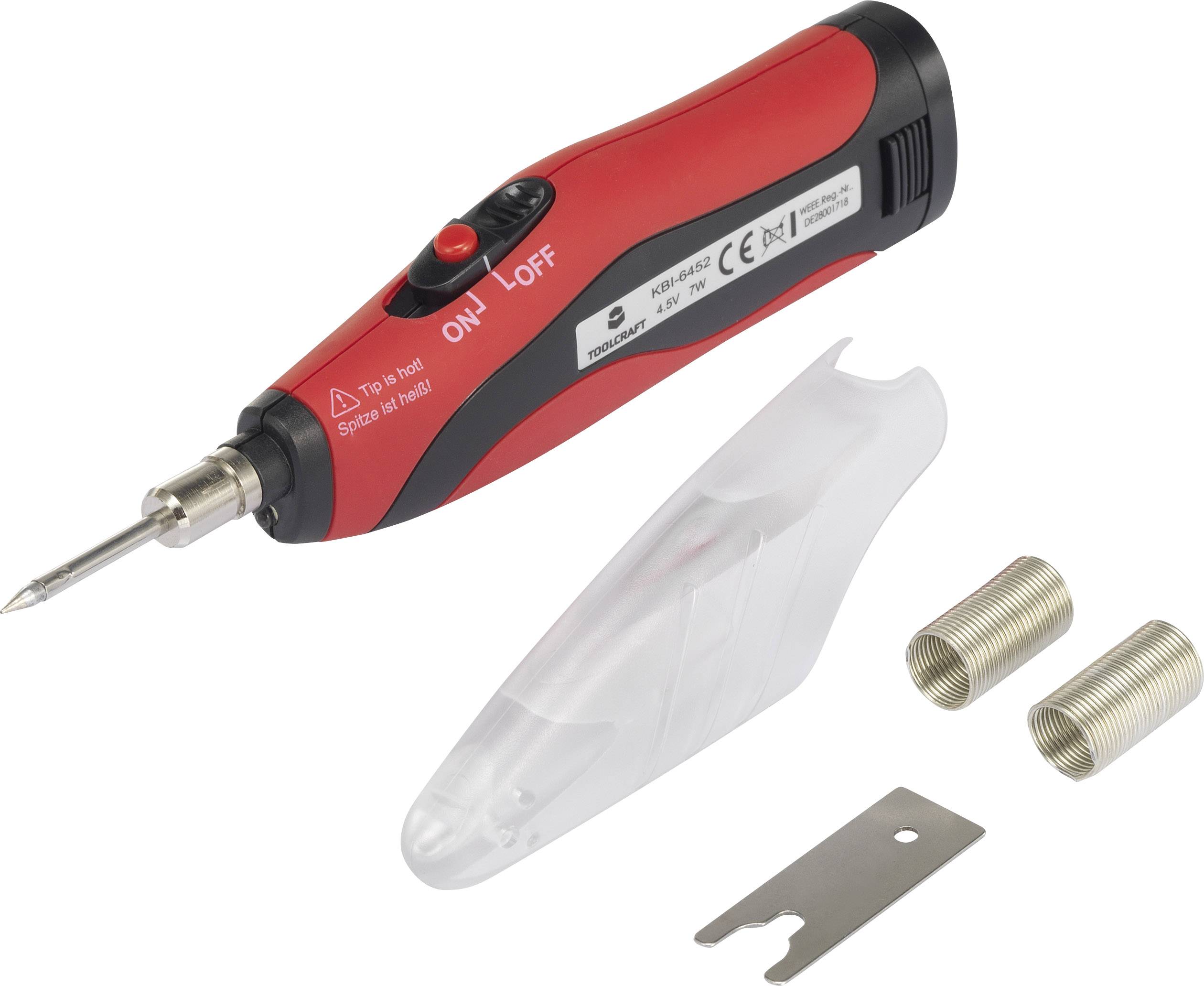Fer à souder électrique rouge et noir avec capuchon de protection, deux pointes de rechange et un outil métallique.