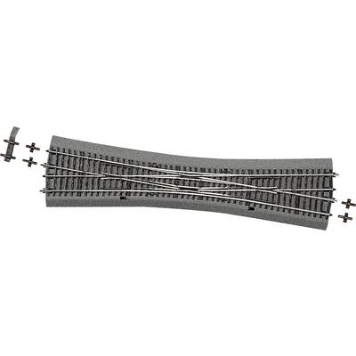 Rails de modélisme ferroviaire avec aiguillage, sur base grise. Quatre petits éléments de croisement à gauche. Convient à la visualisation de parcours ferroviaires.