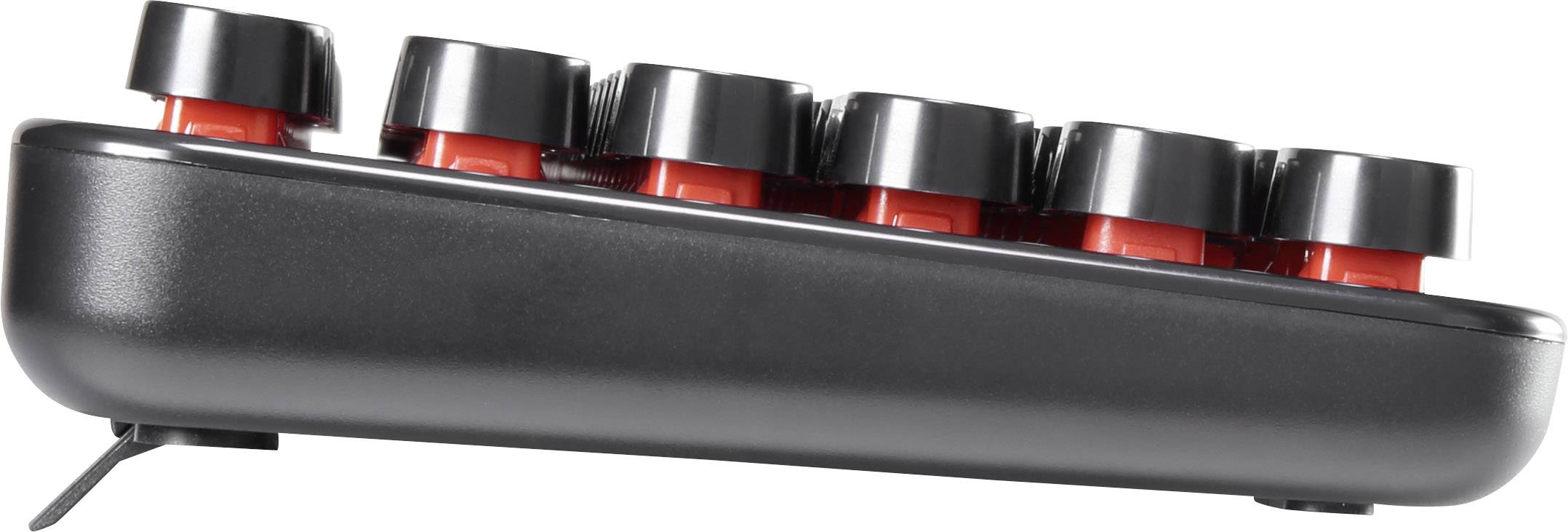 Vue latérale d'un clavier gaming noir avec des touches surélevées rétroéclairées en rouge pour une frappe ergonomique.