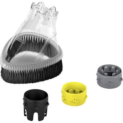Brosse de nettoyage avec des poils noirs et trois embouts interchangeables en noir, jaune et gris, posés à côté.