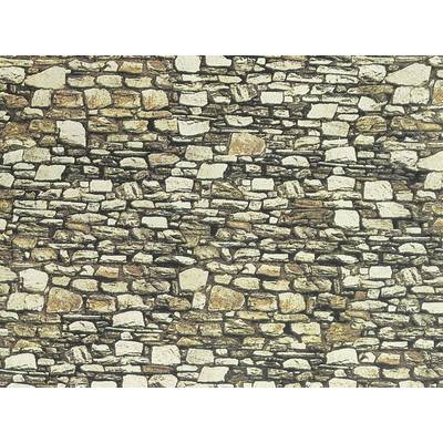 Un mur en pierres naturelles irrégulières de différentes tailles et couleurs, étroitement jointoyées et disposées de manière inégale.