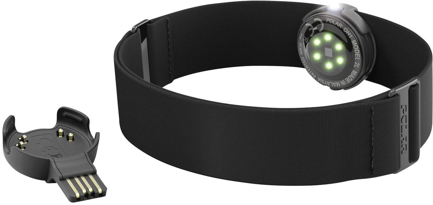 Capteur de fitness noir avec lumière verte pour la mesure du rythme cardiaque, à côté d'un adaptateur de charge USB. Idéal pour les activités sportives.