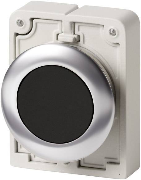 Un grand bouton rond avec un bord argenté sur un fond rectangulaire crème. Le bouton a une surface noire.
