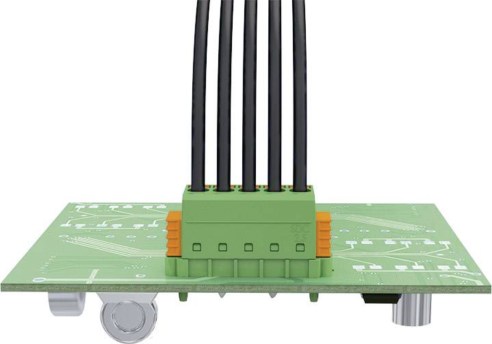 Circuit imprimé vert avec des câbles noirs montés, passant par une connexion centrale. Des composants techniques sont visibles.