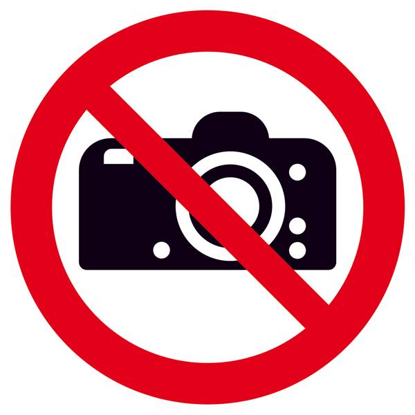 Symbole d'interdiction de photographier : Appareil photo noir avec un panneau d'interdiction rouge au-dessus.
