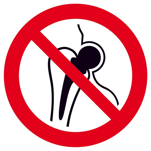 Symbole d'une articulation de hanche barrée en rouge, signalant une interdiction ou un avertissement concernant les prothèses de hanche.