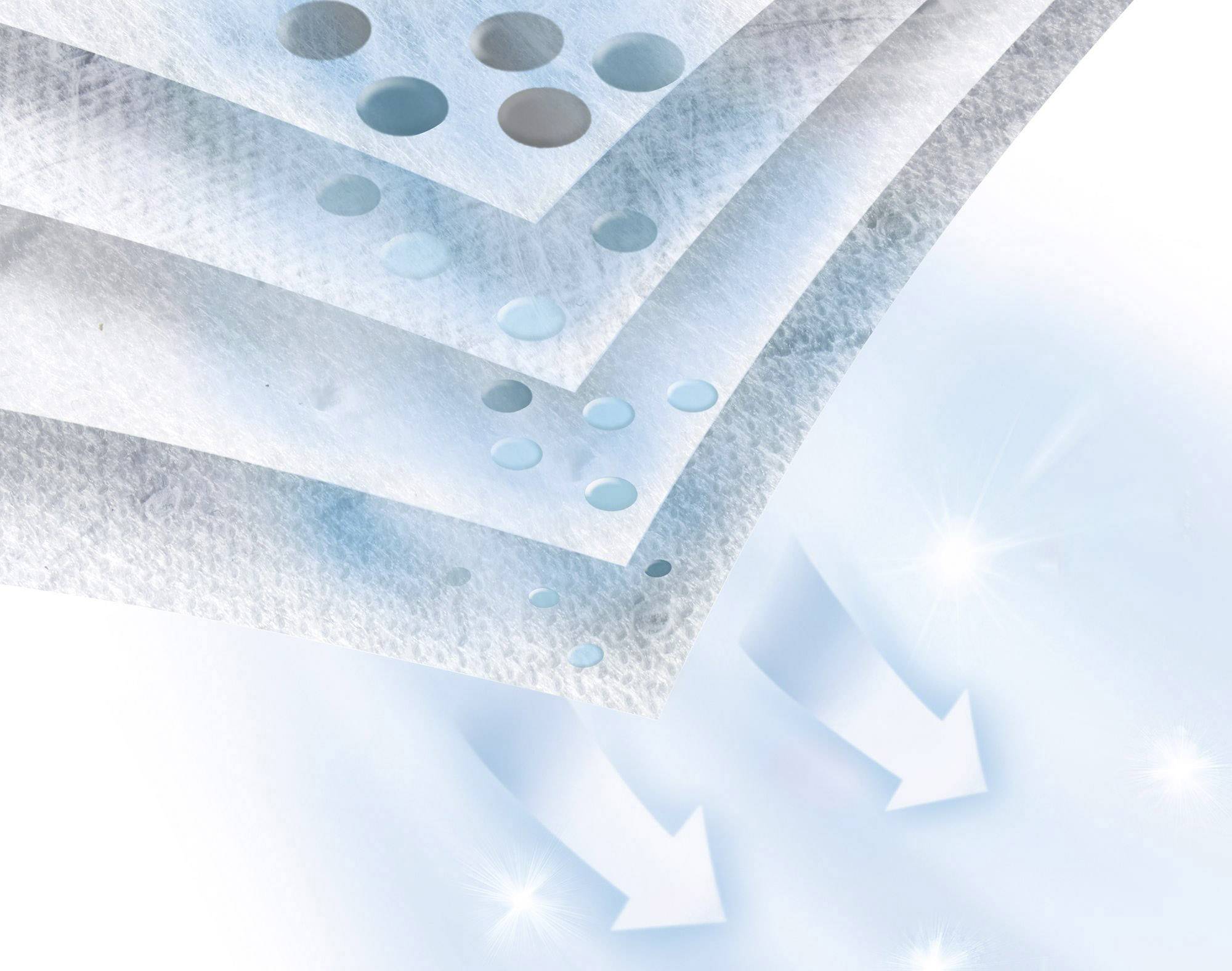 Structure matérielle multicouche avec des particules bleues et grises, des flèches indiquant le flux d'air à travers les couches.