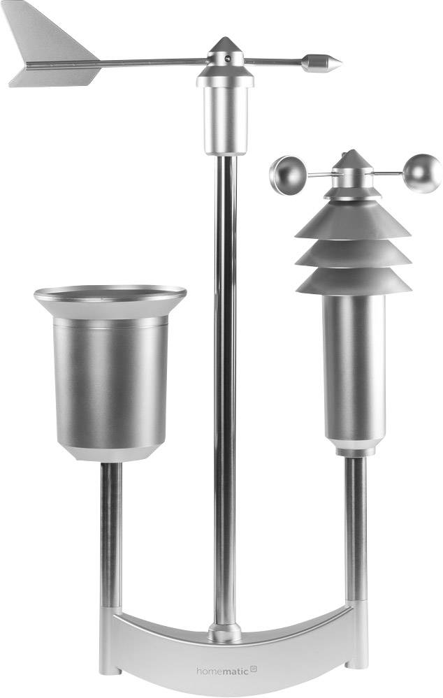 Un capteur de station météorologique en argent avec indicateur de direction du vent, anémomètre et pluviomètre, monté sur un support.