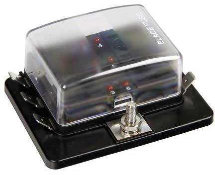 Un porte-fusible avec un couvercle transparent en plastique portant l'inscription 'Blade Fuse', monté sur une base noire avec des contacts métalliques.