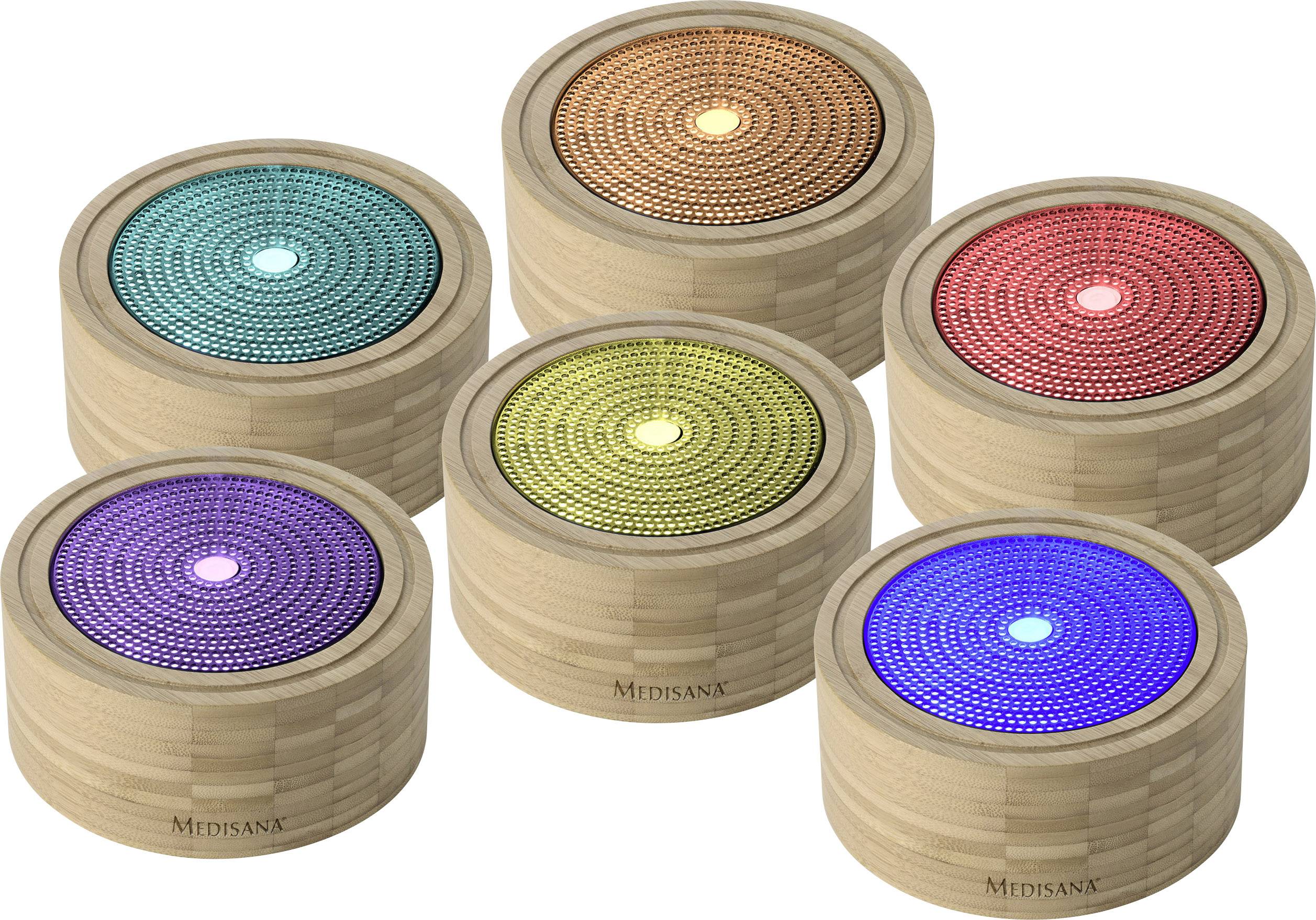 Six diffuseurs d'arômes en bois disposés en demi-cercle, chacun avec une surface lumineuse de couleur différente : Bleu, Vert, Jaune, Orange, Rouge, Violet.