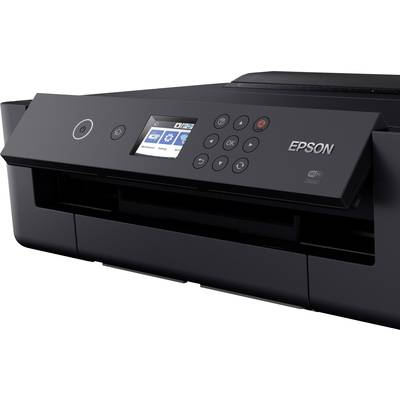 Une imprimante jet d'encre noir avec écran et panneau de commande. Nom de la marque visible.