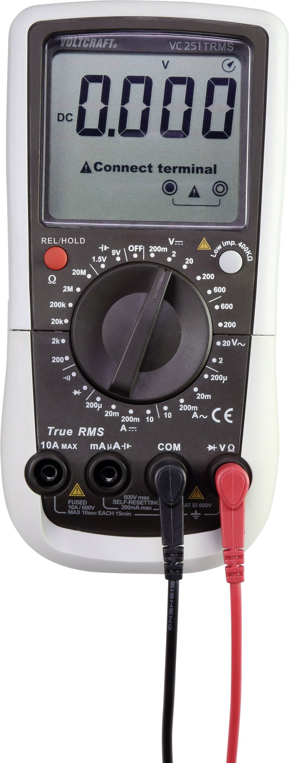 Un multimètre numérique affiche '0.000' volt sur l'écran. Les câbles de mesure sont branchés. Il est en mode mesure de tension.