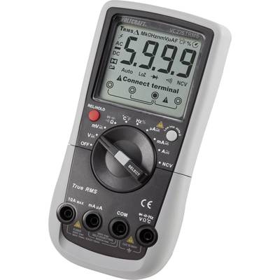 Un multimètre numérique avec affichage LCD indique la valeur de mesure '59,99'. Il est équipé d'un commutateur rotatif pour différentes fonctions de mesure et de quatre bornes sur le bord inférieur.