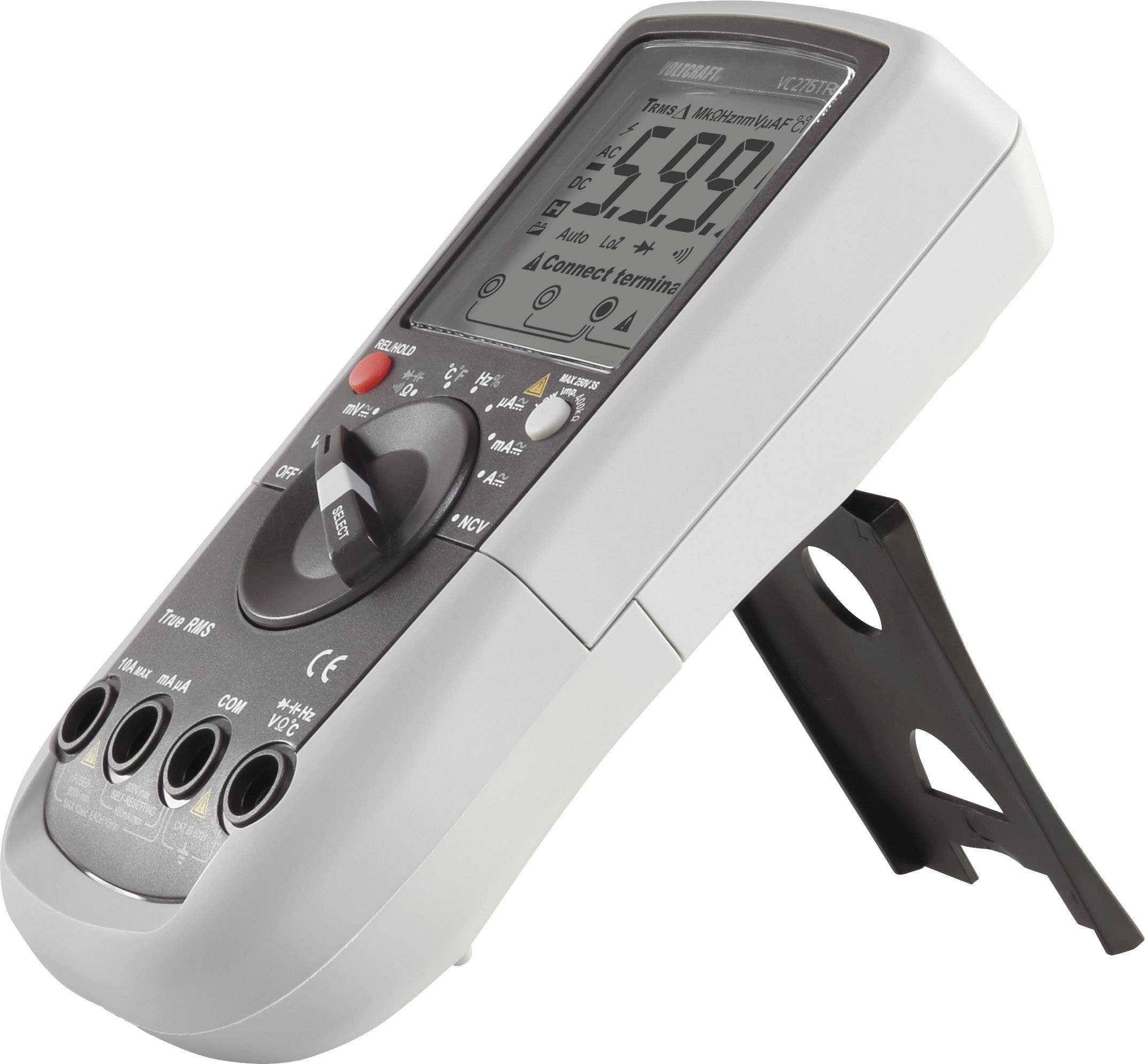 Multimètre numérique en vue latérale, affichant 5,99 V sur l'écran. L'appareil est posé sur son support dépliable.