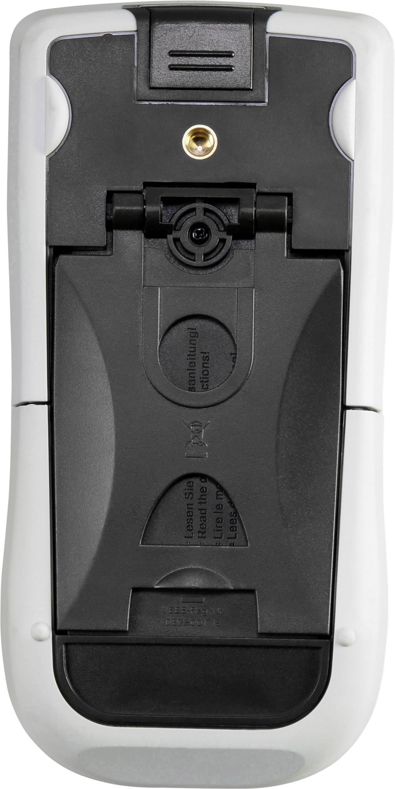 Arrière d'une télécommande avec un compartiment à piles et un connecteur doré en haut.