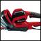 Un taille-haie rouge Einhell. Montre la poignée et le corps principal de l'outil, adapté aux travaux de jardinage.