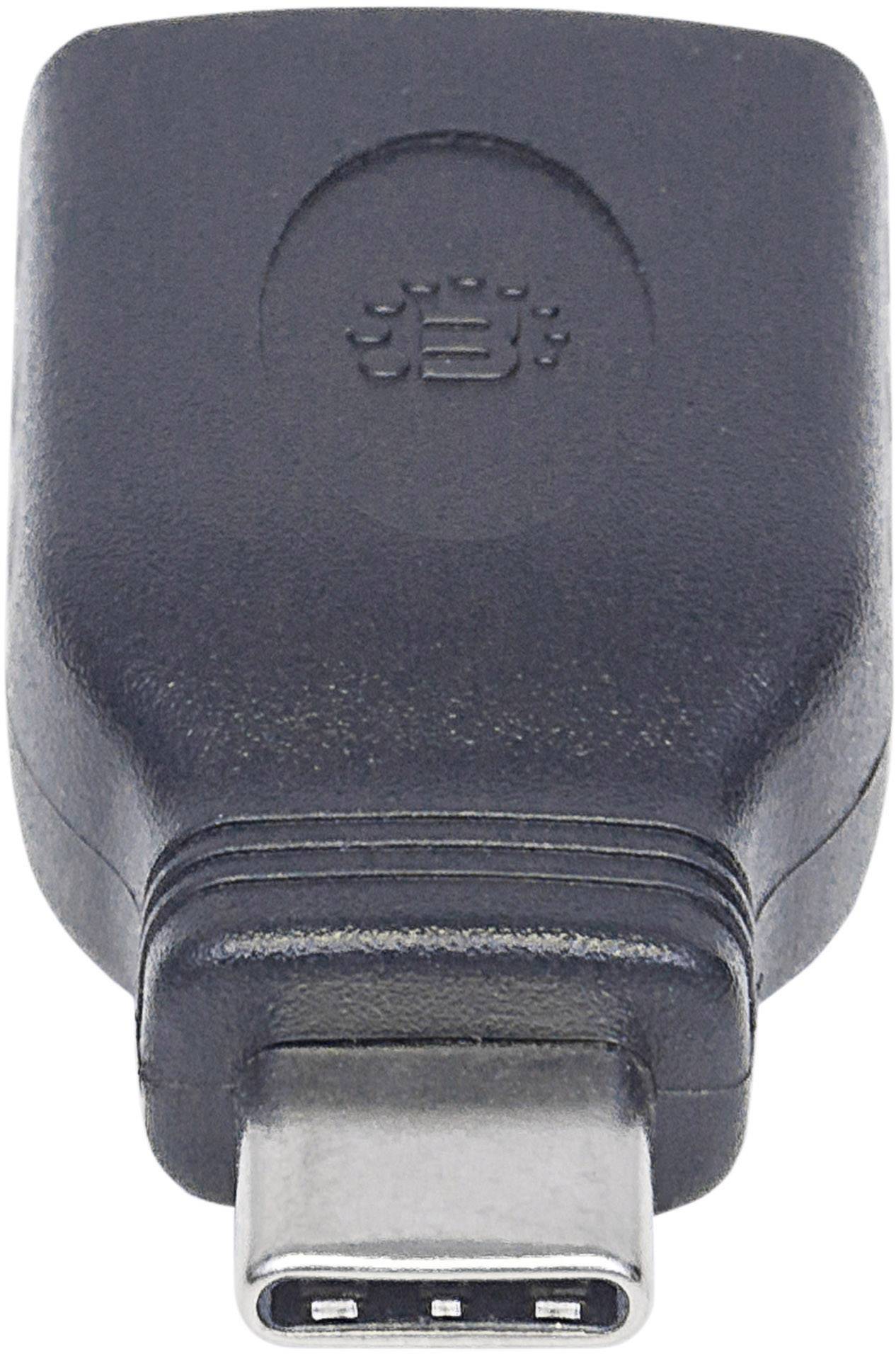 Un adaptateur noir USB-C pour connecter des appareils avec différents types de ports.