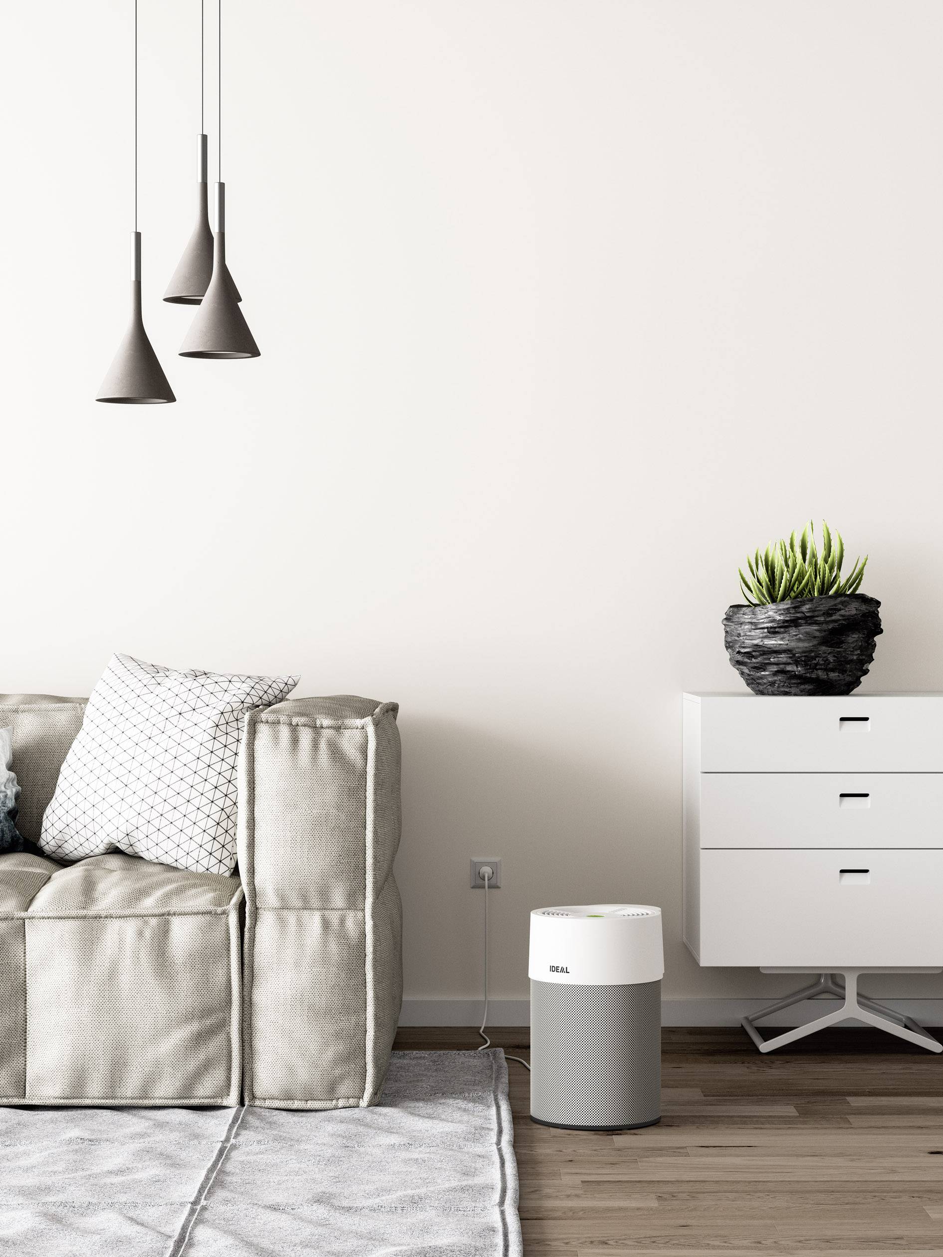 Salon moderne avec canapé beige, coussins, armoire blanche, décoration élégante et purificateur d'air sur un sol en bois.