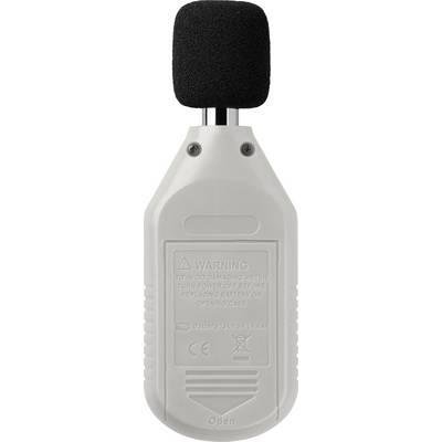 Le dos d'un sonomètre portable, avec un message d'avertissement conseillant la prudence lors du changement de pile.