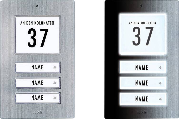 Deux plaques de sonnette au design moderne, à gauche argentée, à droite noire. Les deux indiquent l'adresse « An den Kolonaten 37 » et comportent trois touches de nom.