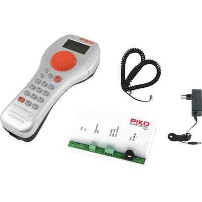 Ensemble de télécommande à distance comprenant une télécommande manuelle, un câble spiralé, une centrale de commande et un bloc d'alimentation. Adapté pour la commande de modèles réduits de trains.