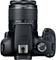 Appareil photo reflex numérique vu de dessus avec molette de sélection des modes rotative et objectif zoom ; adapté aux passionnés de photographie.