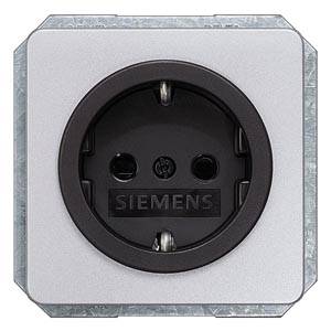 Prise électrique argentée avec un bord noir, nom de marque 'Siemens' visible au centre.