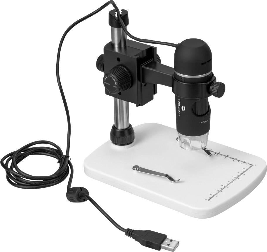 Un microscope numérique USB sur un support blanc. Une règle est présente à la base, utilisée pour des mesures précises.