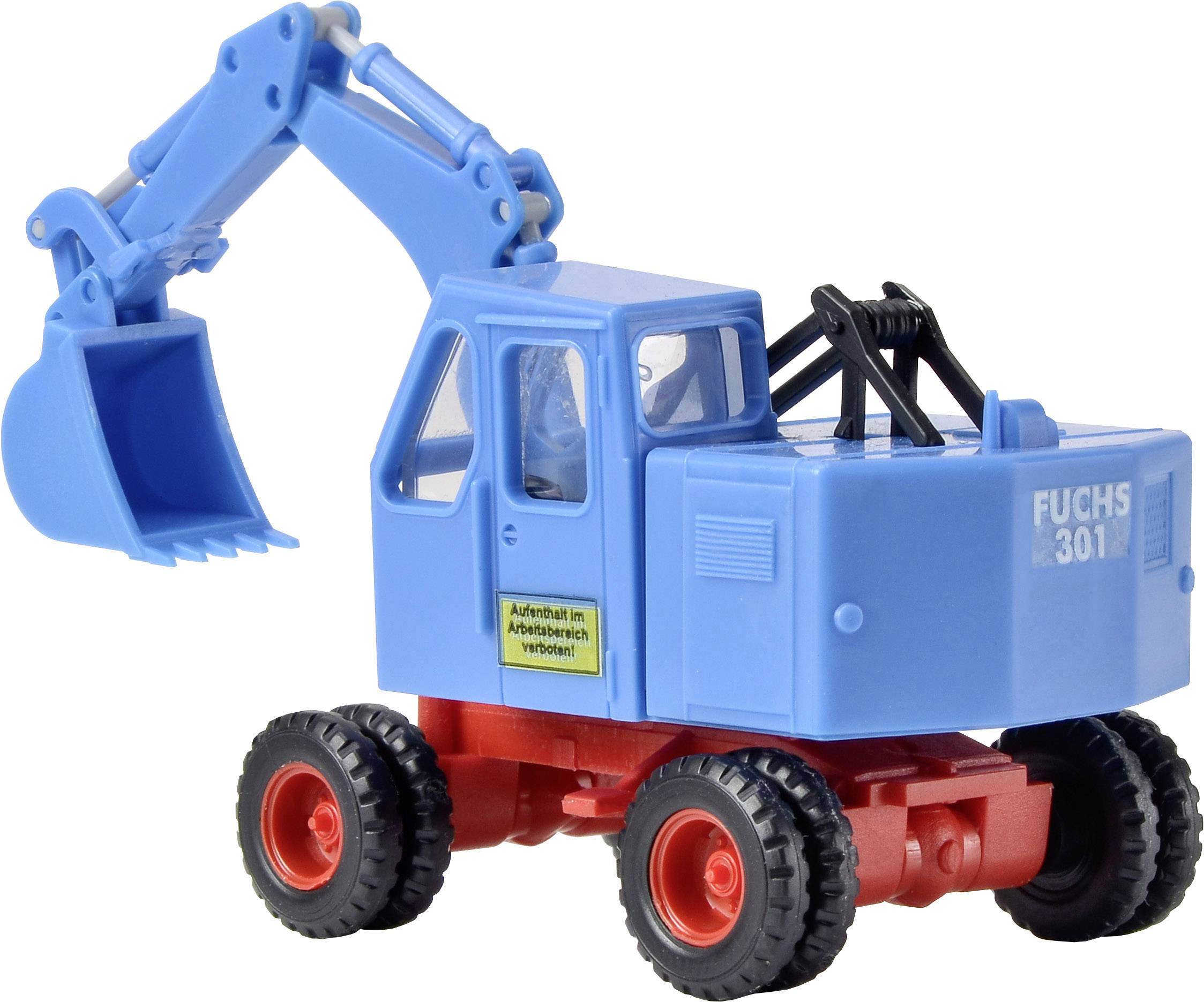 Pelleteuse-jouet en bleu avec quatre roues et bras articulé. Inscrit avec 'Fuchs 301', panneau : 'Défense de travailler dans cette zone'.