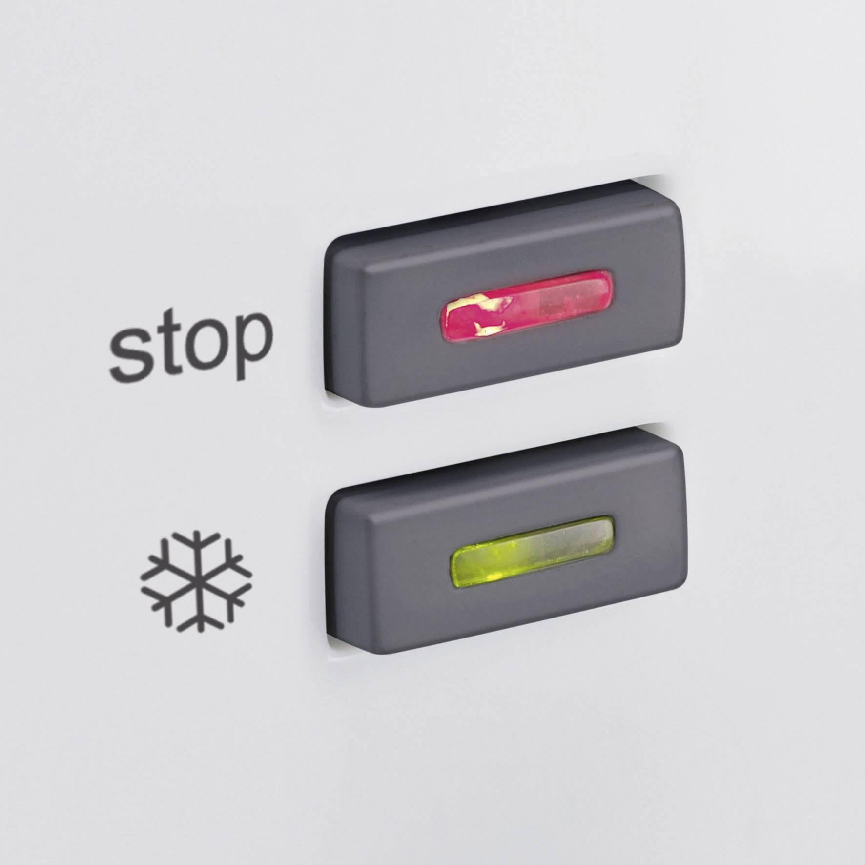 Deux boutons rouge et vert sur un appareil. Le bouton rouge est intitulé 'stop', à côté d'un symbole de froid.