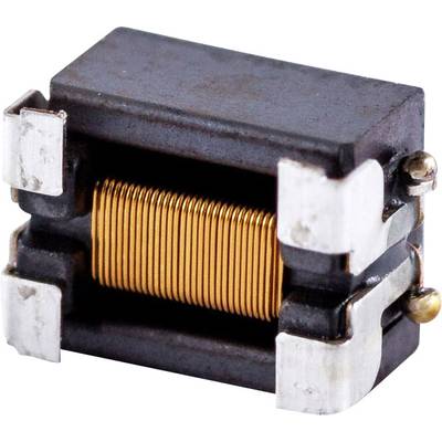 Une petite bobine enroulée d'un fil de cuivre, placée entre deux bornes métalliques dans un boîtier rectangulaire, comme utilisée dans les circuits électroniques.