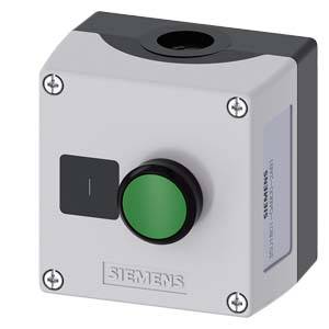 Un boîtier carré Siemens avec un bouton vert et une surface grise. Semble probablement servir d'interrupteur de commande.