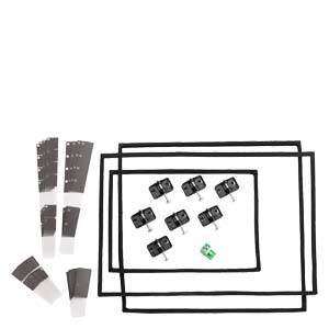 Un ensemble comprenant plusieurs joints noirs, des clips noirs et deux bandelettes de test blanches. Accessoires pour l'installation d'appareils.