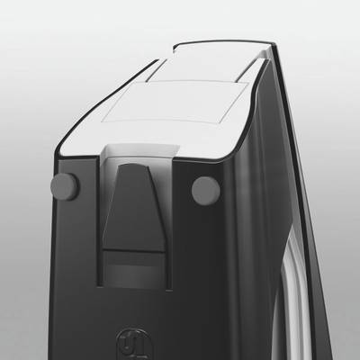 Rasoir électrique noir et blanc, gros plan ; focus sur la tête de coupe avec des lames tranchantes et un design de poignée ergonomique.