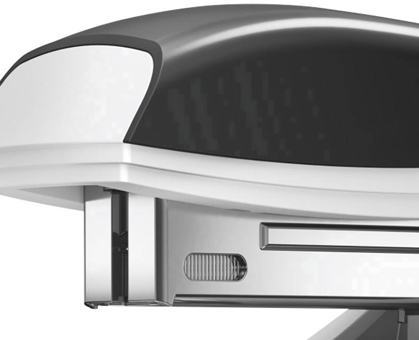 Gros plan d'un agrafeuse en argent et noir, partiellement ouverte, révélant l'emplacement des agrafes.