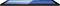 Une tablette noire est posée à plat avec son écran visible, affichant des tons de bleu et de couleurs sombres. La partie inférieure présente des grilles de haut-parleurs reconnaissables.