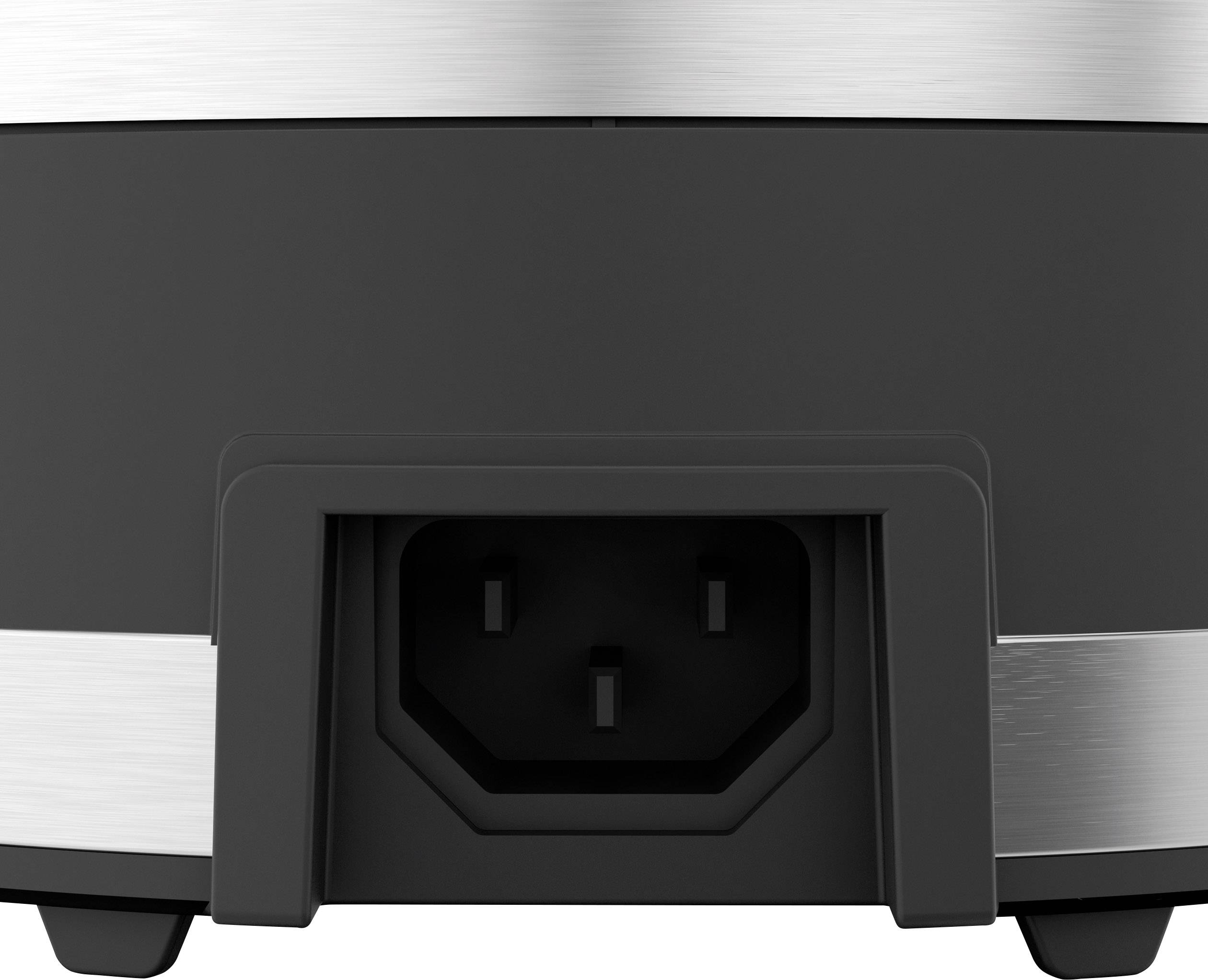 Branchement électrique d'un appareil électrique, représenté en gros plan avec un boîtier en plastique noir et un cadre métallique.