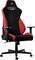 Chaise de gaming ergonomique en noir et rouge avec accoudoirs réglables, dossier haut et roulettes, adaptée aux environnements de bureau.