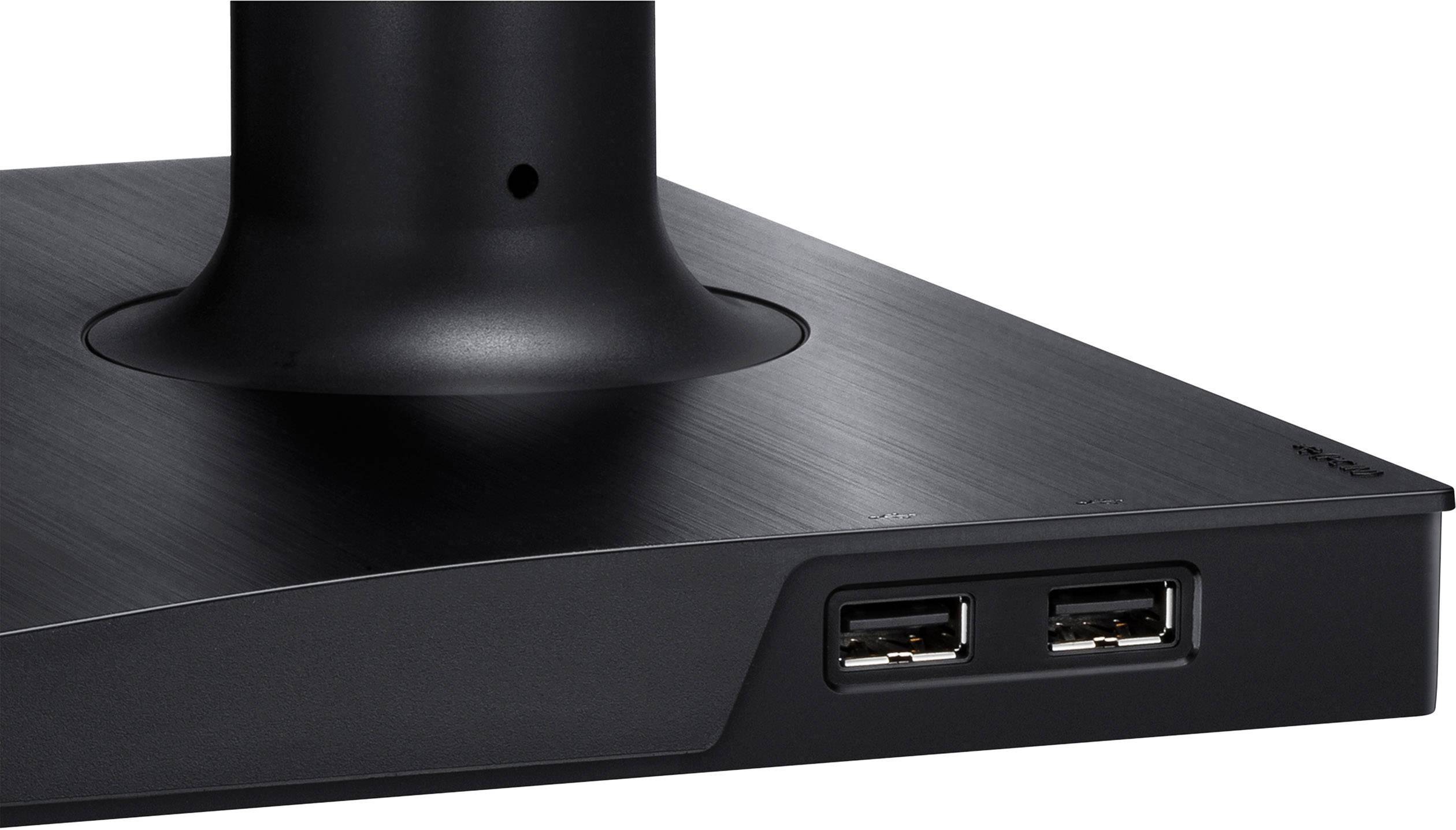 La partie inférieure d'un support de moniteur doté de deux ports USB près de sa base, avec un tube noir monté dessus pour la fixation de l'écran.