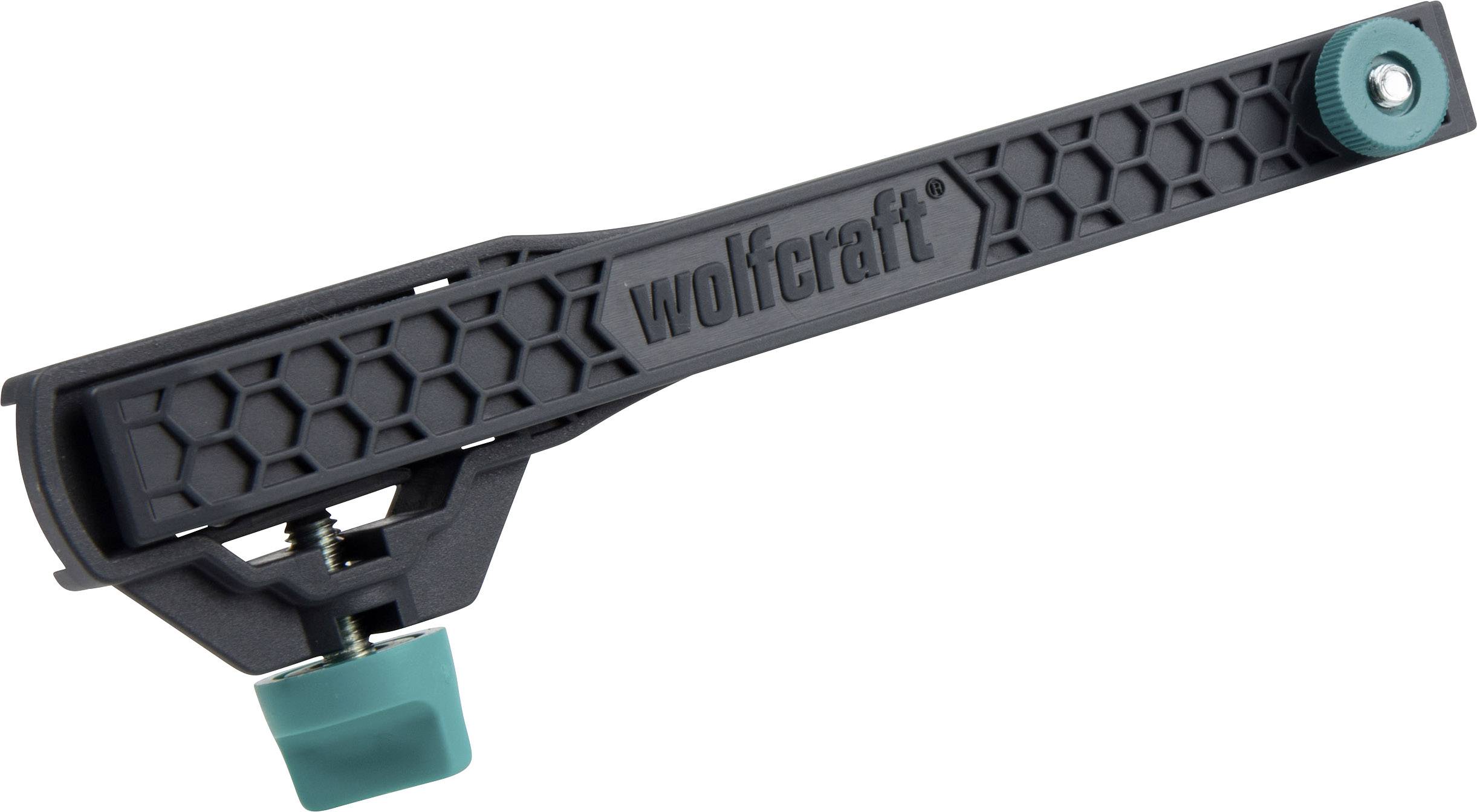 Un serre-joint à angle en plastique noir et vert avec un motif alvéolé sur la poignée et une pince à vis à la base. Marqué 'wolfcraft'.