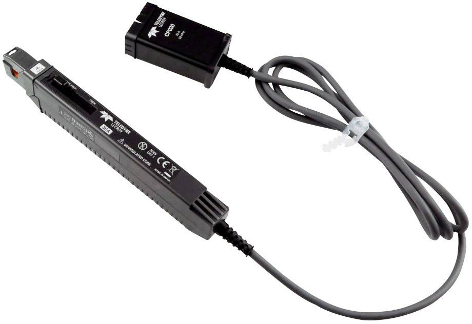 Un appareil électronique noir avec des câbles et des connexions est présenté, probablement un adaptateur ou un convertisseur pour des applications techniques.