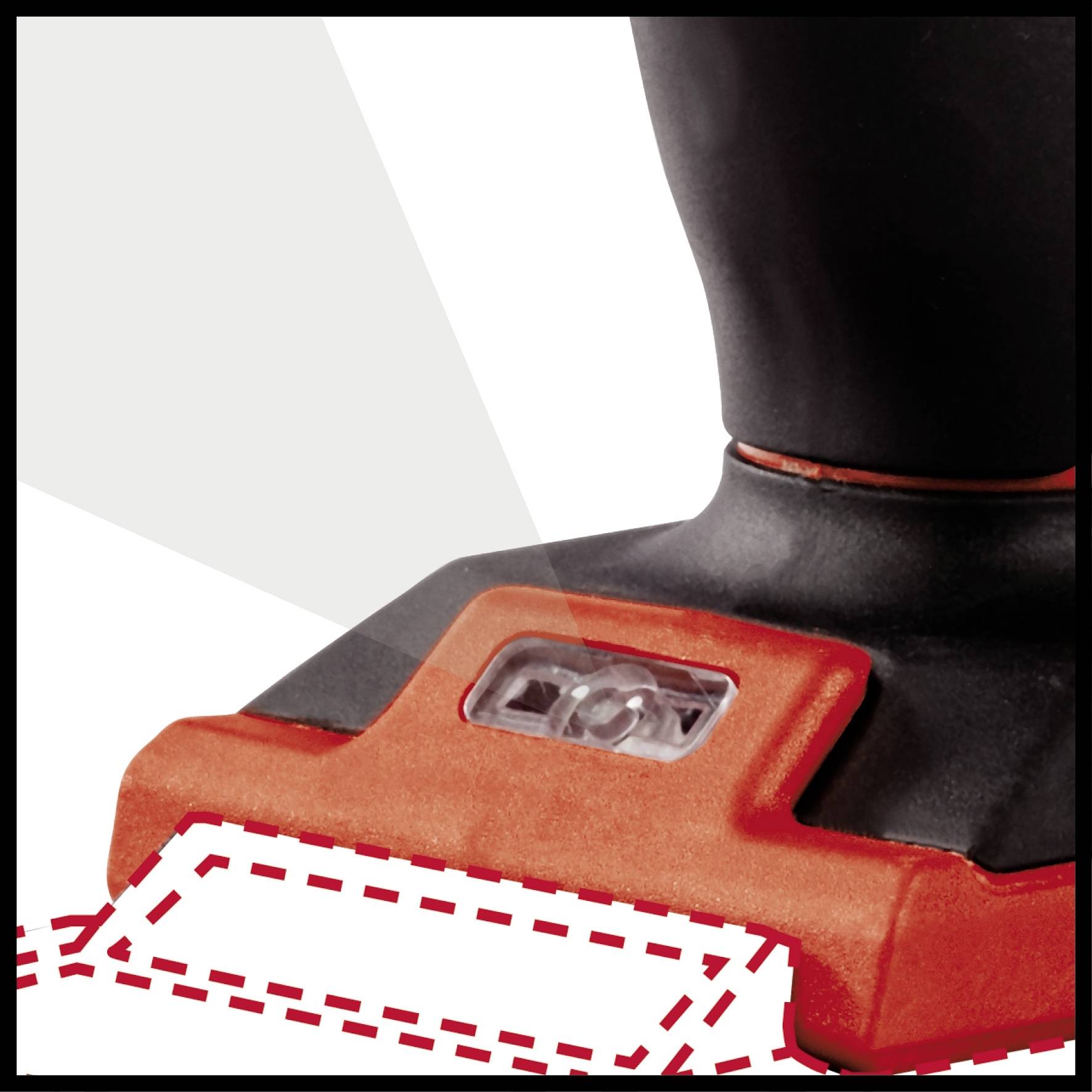 Un embout d'aspirateur noir avec un bord rouge nettoie une surface. Des lignes marquées indiquent la zone de nettoyage.